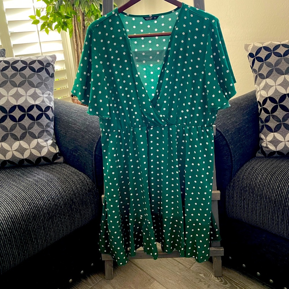 Short sleeve green dress with white polkadots